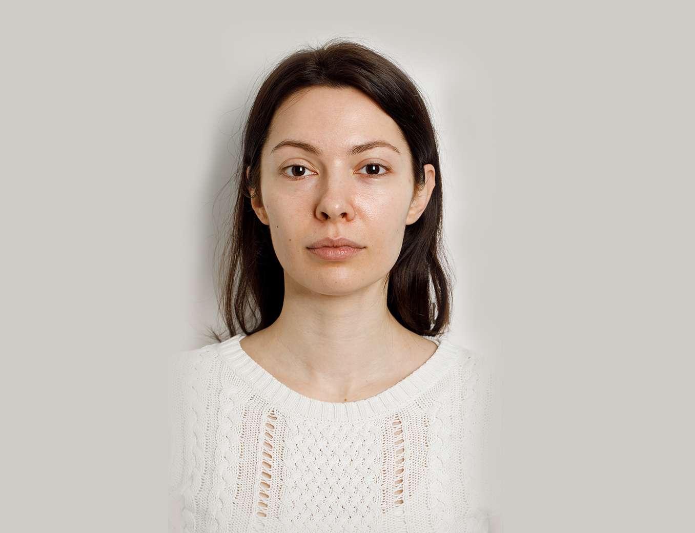a woman in a white sweater